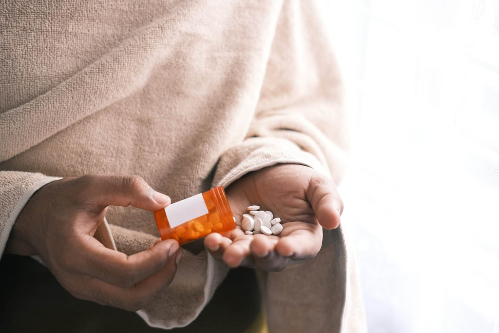 a teen taking a substance abused pill