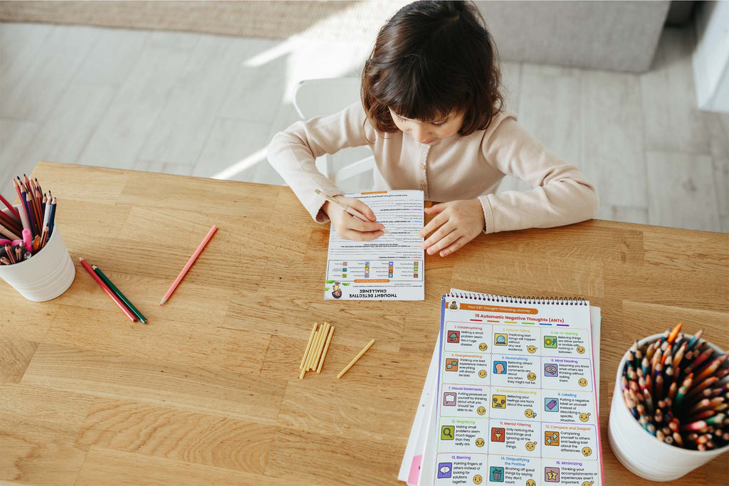 a child answering a cbt workbook