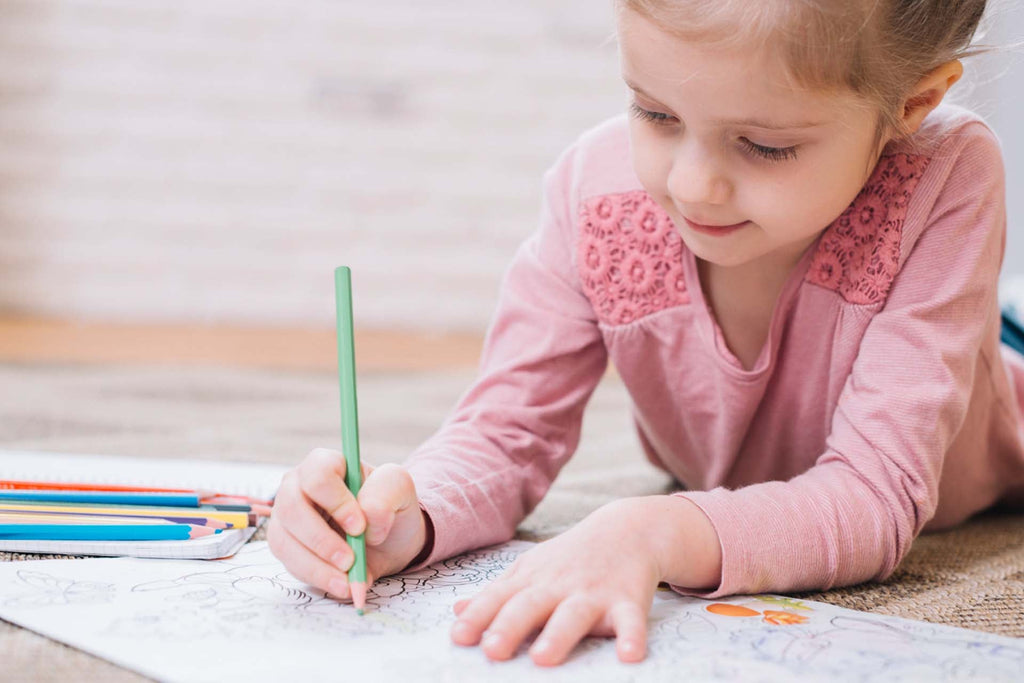 a child drawing and coloring emotions