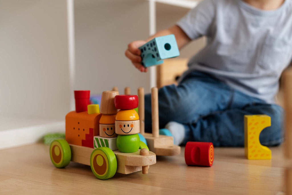 a child playing with montesorri toys
