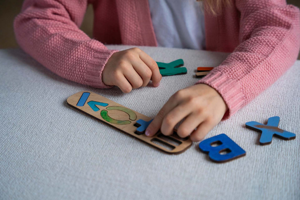 a dyslexic child identifying letters