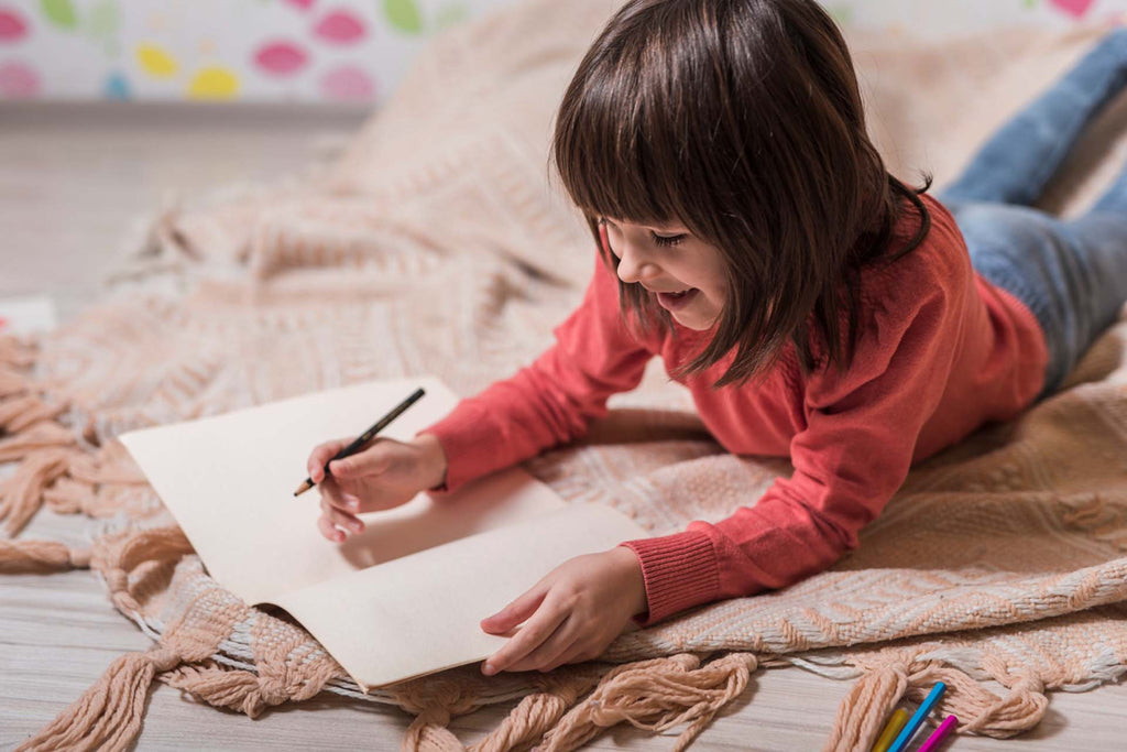 a kid journaling to soothe her self