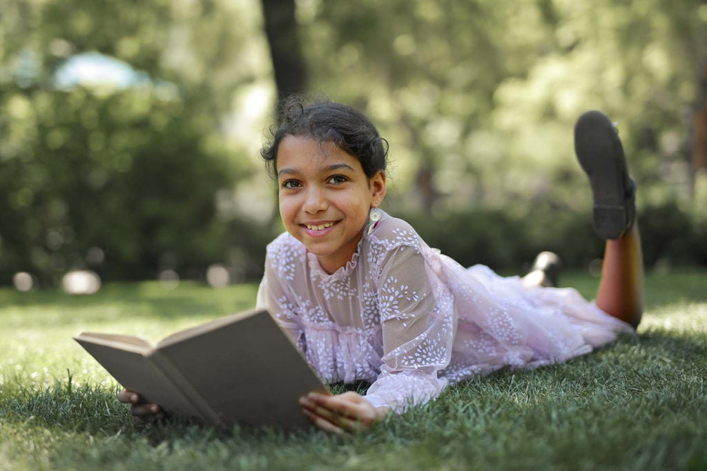 a kid reading books about responsibilities for kids