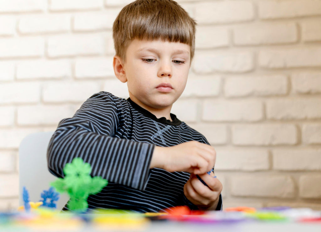 a kid with asd playing puzzle