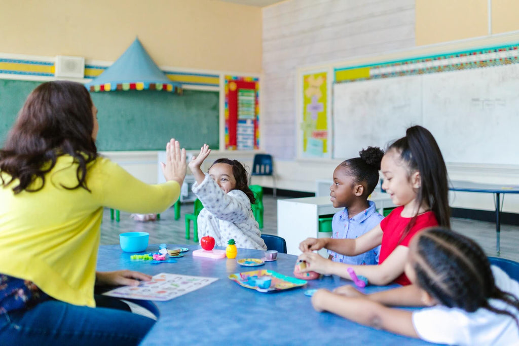 a teacher teaching kids essential character traits