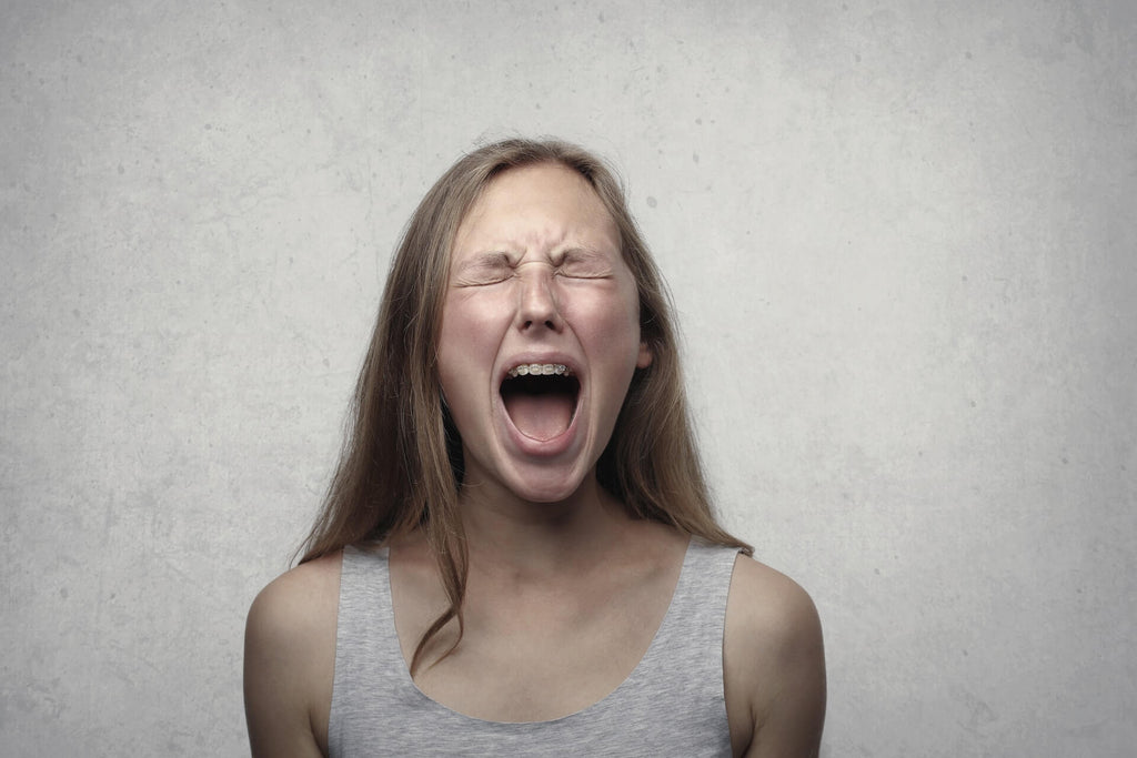 an angry teenager shouting