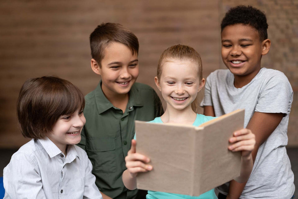 happy kids reading a book about friendship together