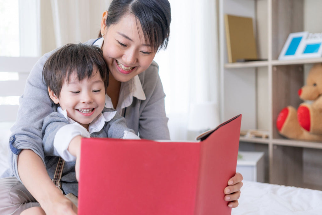 mother and little son reading book about separation anxiety